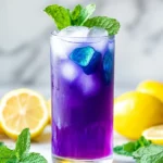 butterfly pea lemonade with lemon and mint